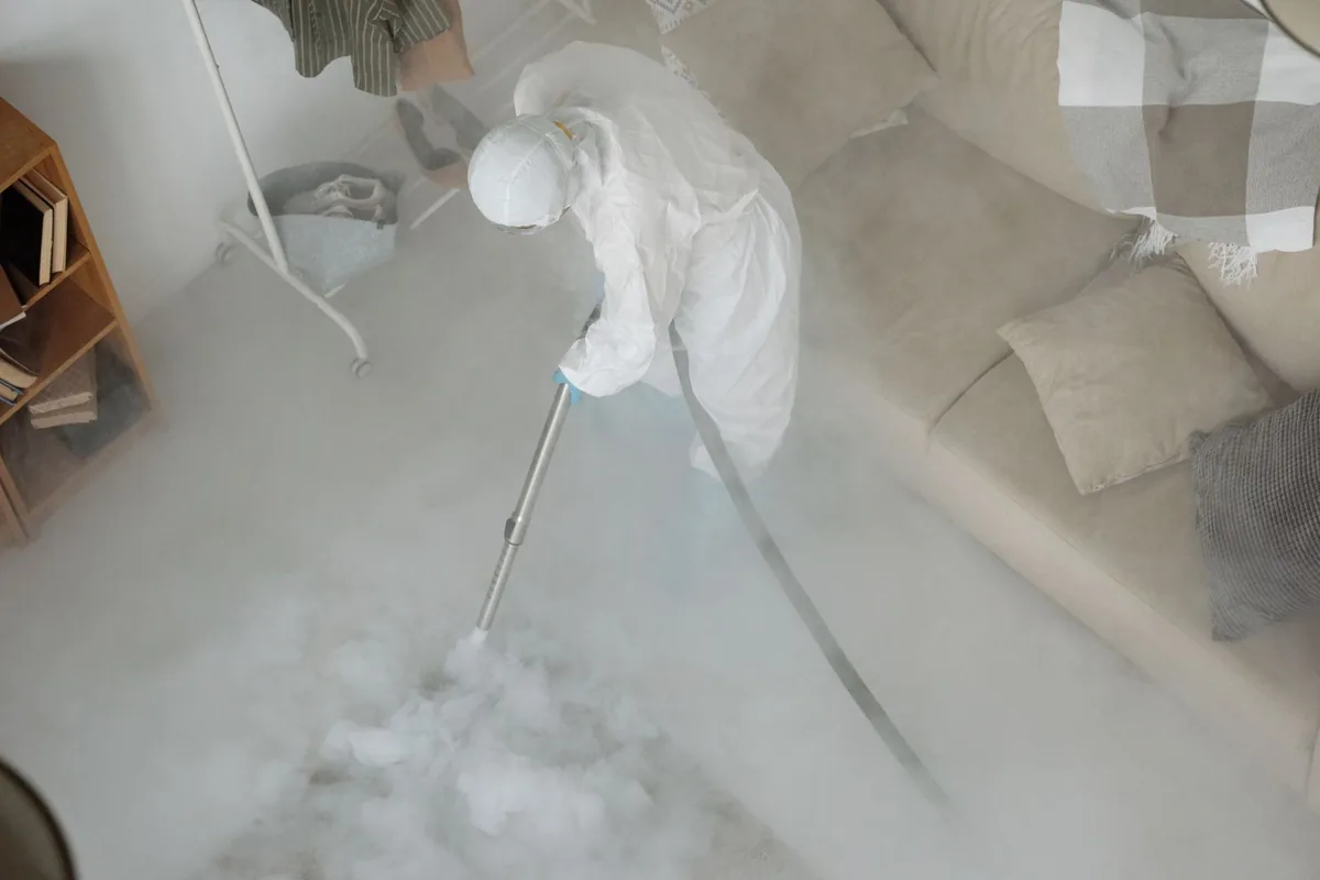 Biohazard cleanup technician in protective equipment, King, WI